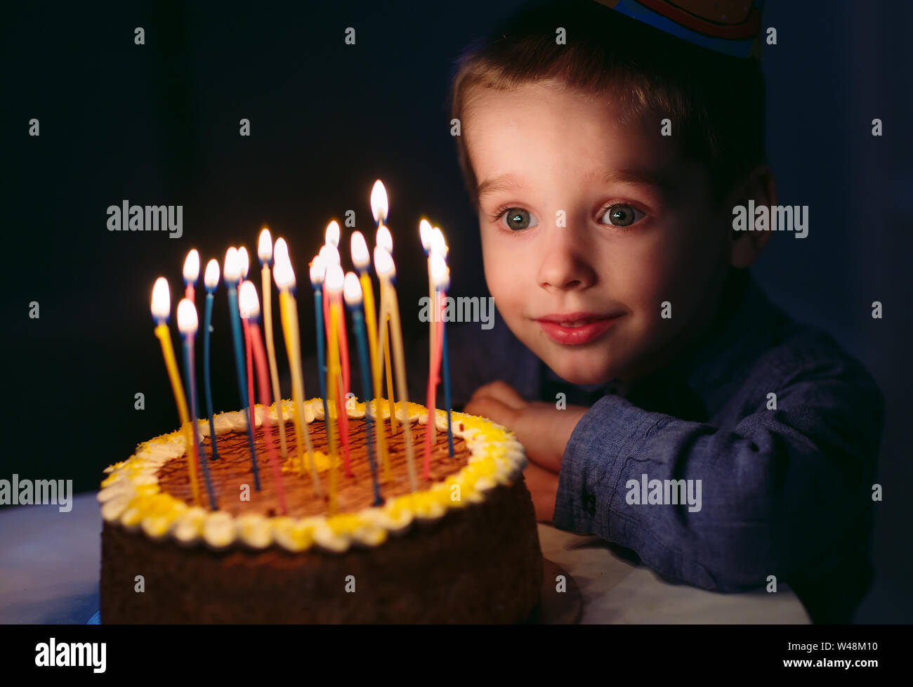 Boy blow out candles on hires stock photography and images Alamy
