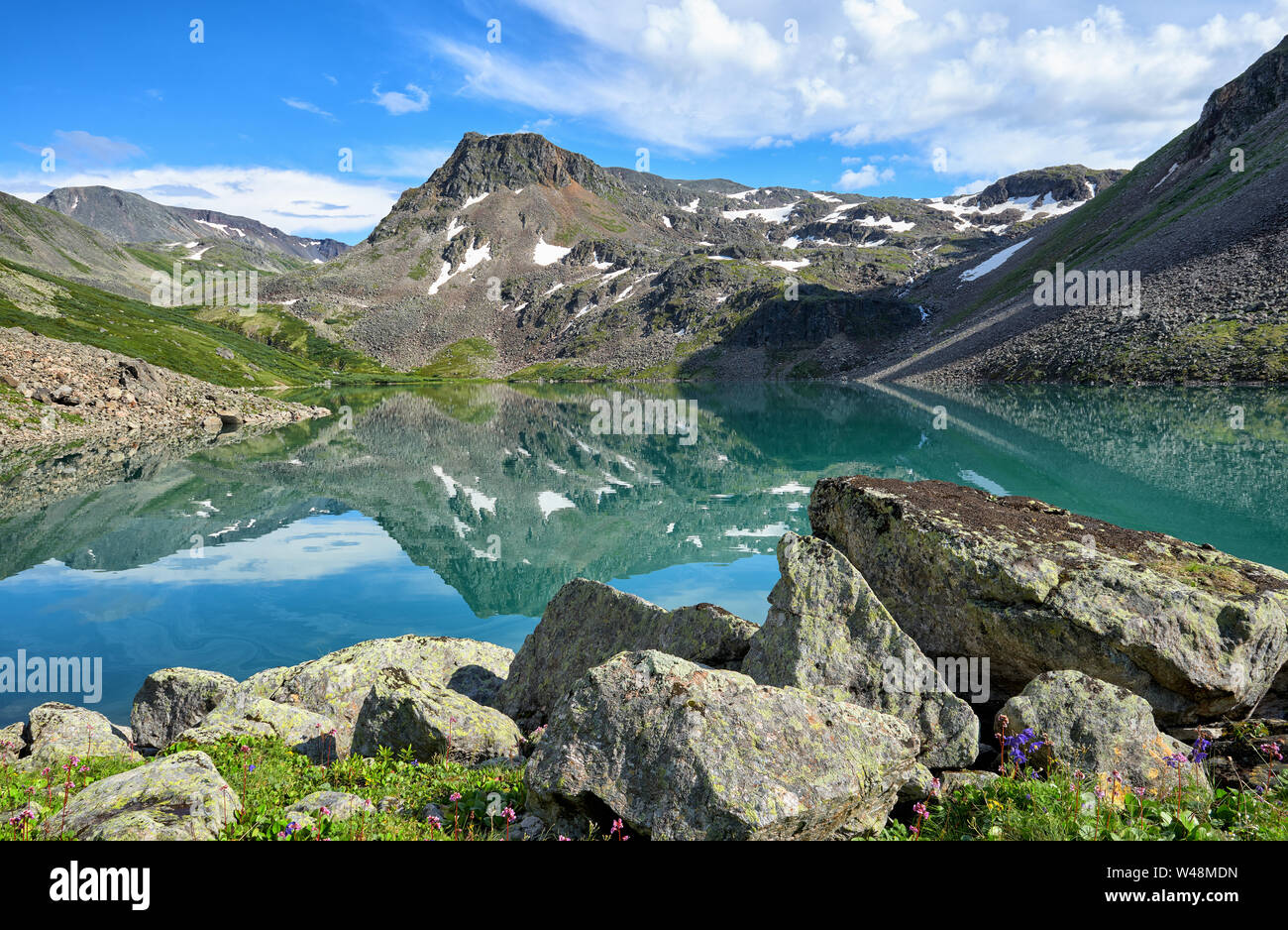 Beautiful water of small lake in Eastern Siberia. Sayan mountains. Republic Tyva Stock Photo
