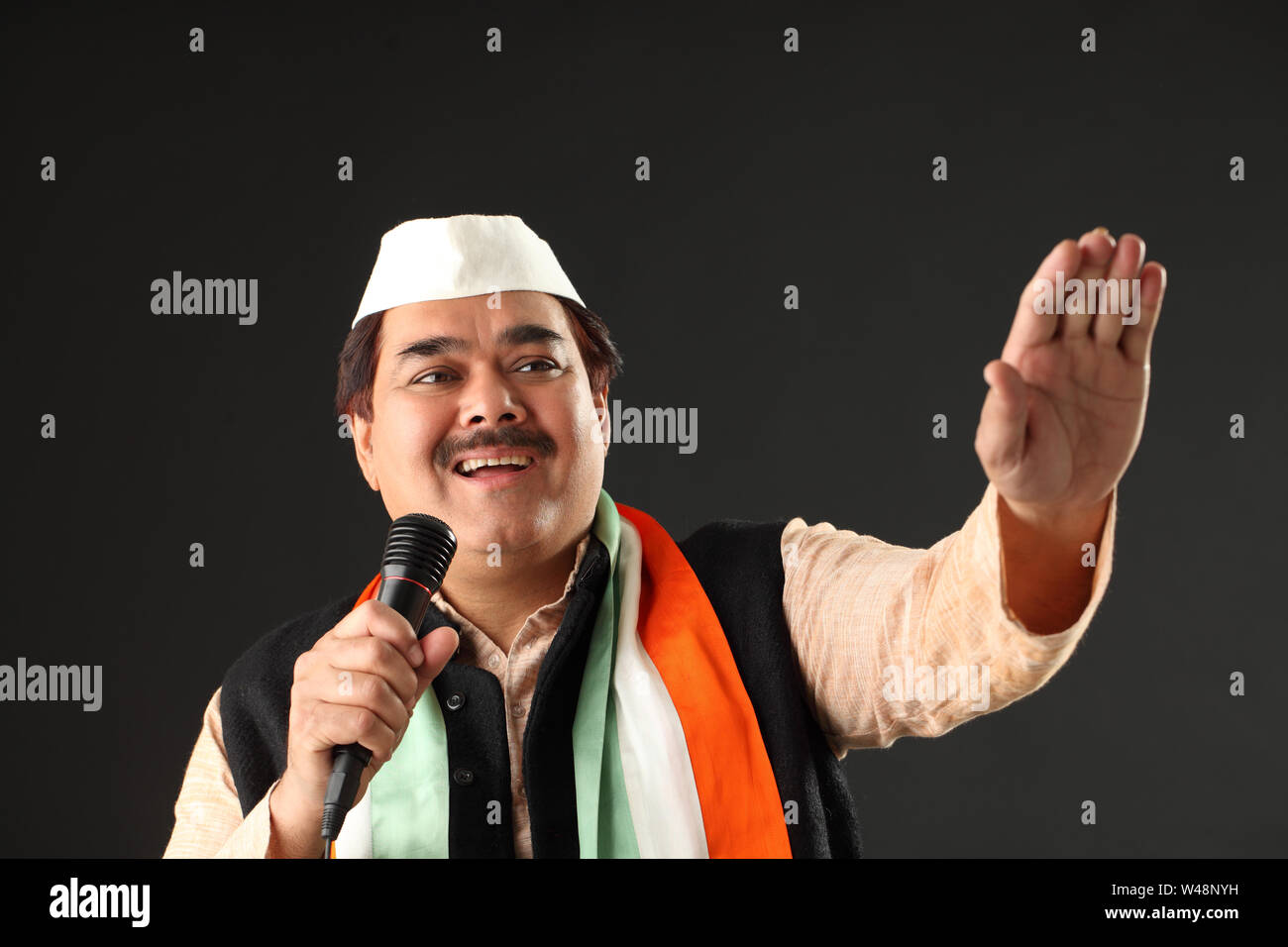 Indian politician giving speech and waving hands Stock Photo