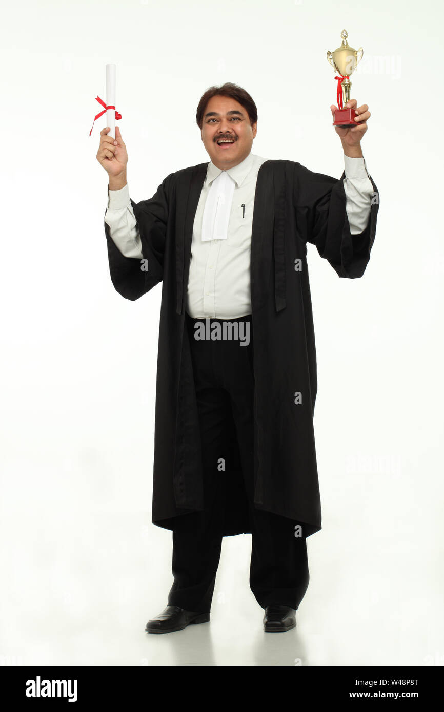 Mature student holding graduation degree Stock Photo Alamy