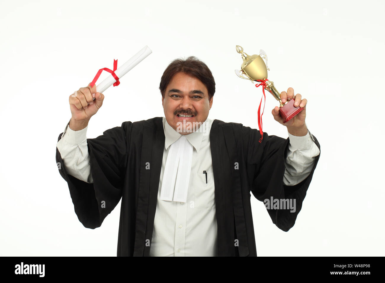 Mature student holding graduation degree Stock Photo Alamy