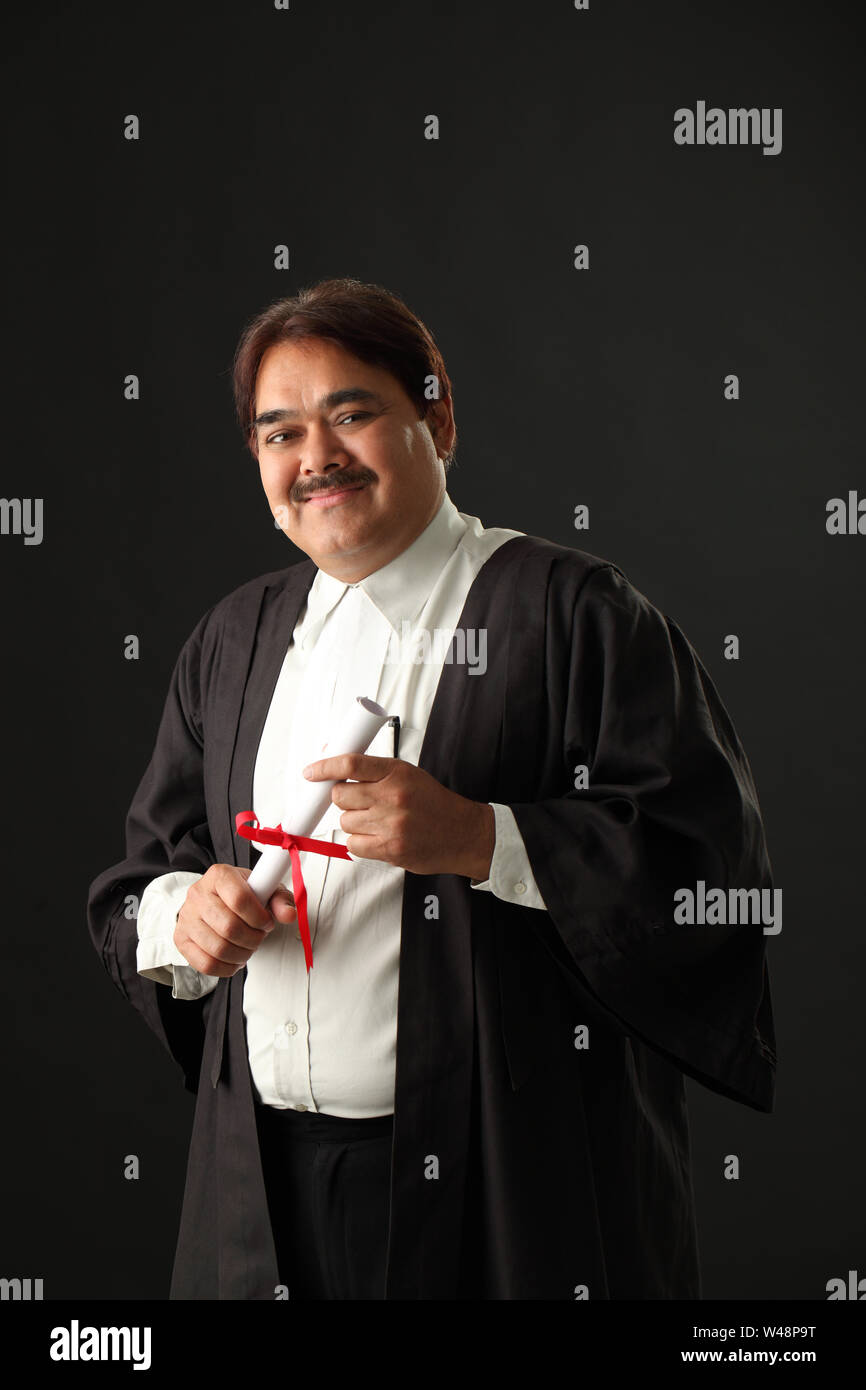 Mature student holding graduation degree Stock Photo Alamy