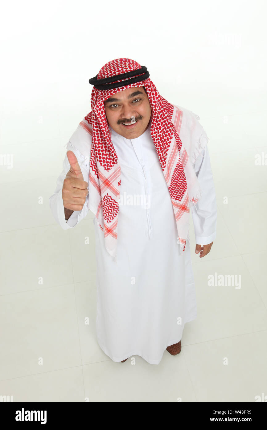 Arabian man showing thumbs up sign and smiling Stock Photo - Alamy
