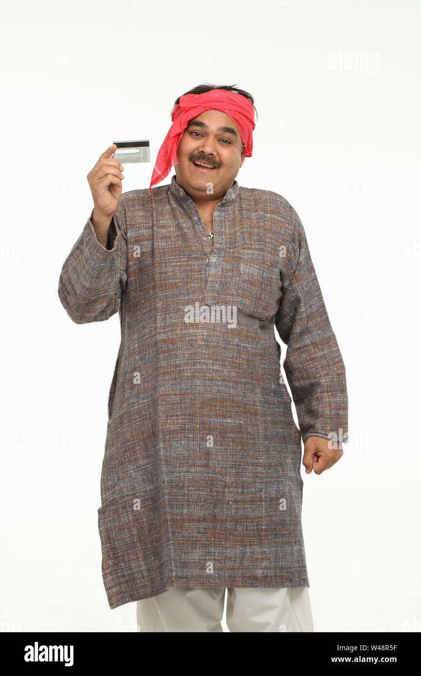Rural man showing credit card and smiling Stock Photo - Alamy
