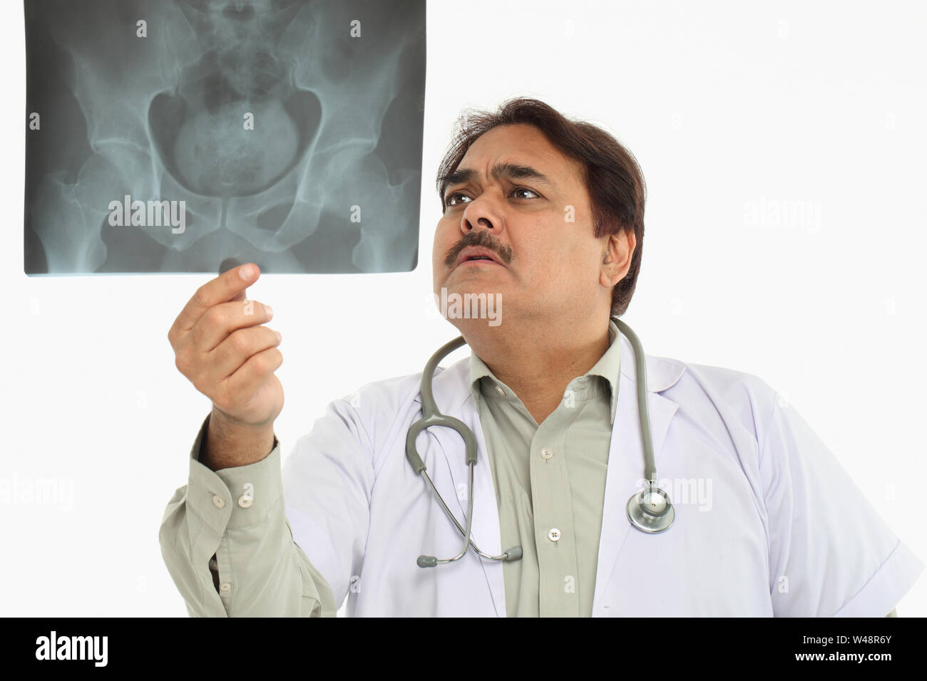 Indian doctor holding up x ray hi-res stock photography and images - Alamy