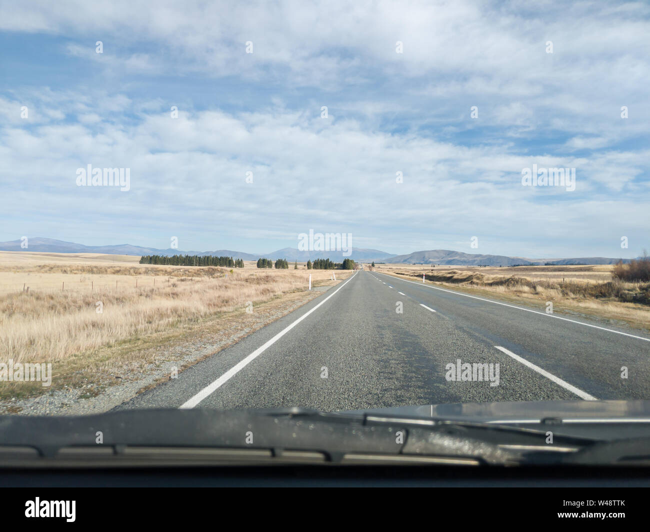 View from the car, Southern Alps mountain range on the road in New Zealand Stock Photo