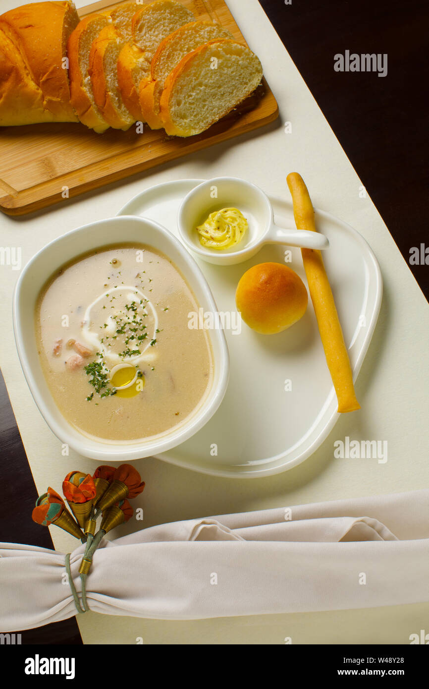 Soup with bread served in tray Stock Photo