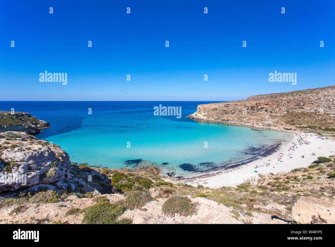 Lampedusa Island Sicily - Rabbit Beach and Rabbit Island  Lampedusa “Spiaggia dei Conigli” with turquoise water and white sand at paradise beach. Stock Photo