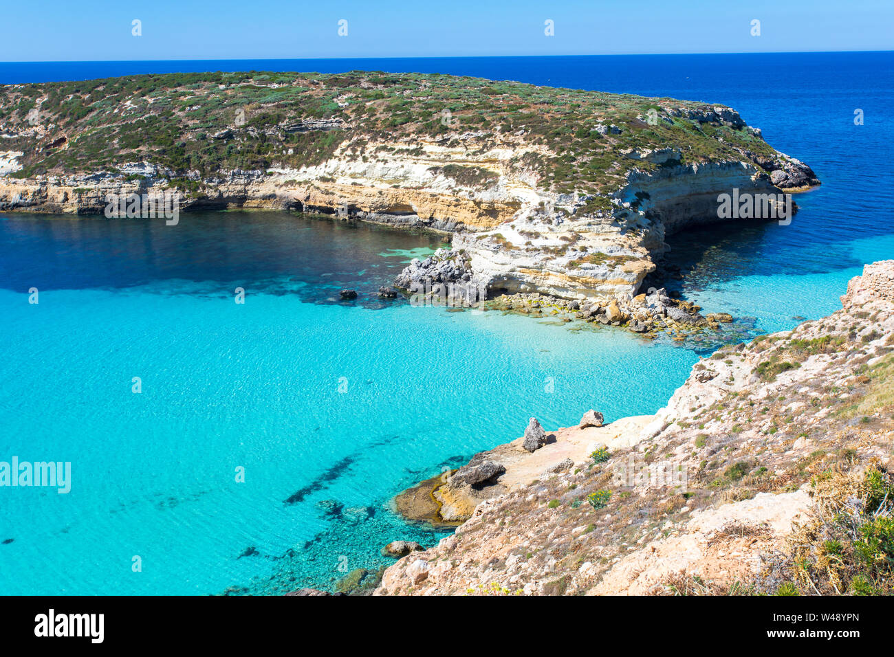Lampedusa Island Sicily - Rabbit Beach and Rabbit Island  Lampedusa “Spiaggia dei Conigli” with turquoise water and white sand at paradise beach. Stock Photo