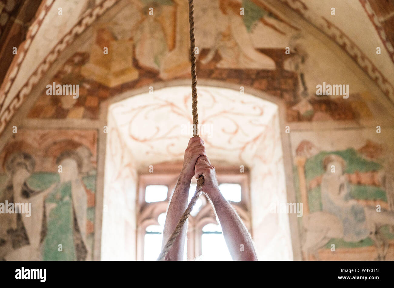 Essingen, Germany. 21st July, 2019. The bell is rung by hand after the inauguration. A new bell was inaugurated in the Protestant Wendelinus Chapel. The bell replaces a sounding body with inscription from the NS era. Credit: Andreas Arnold/dpa/Alamy Live News Stock Photo