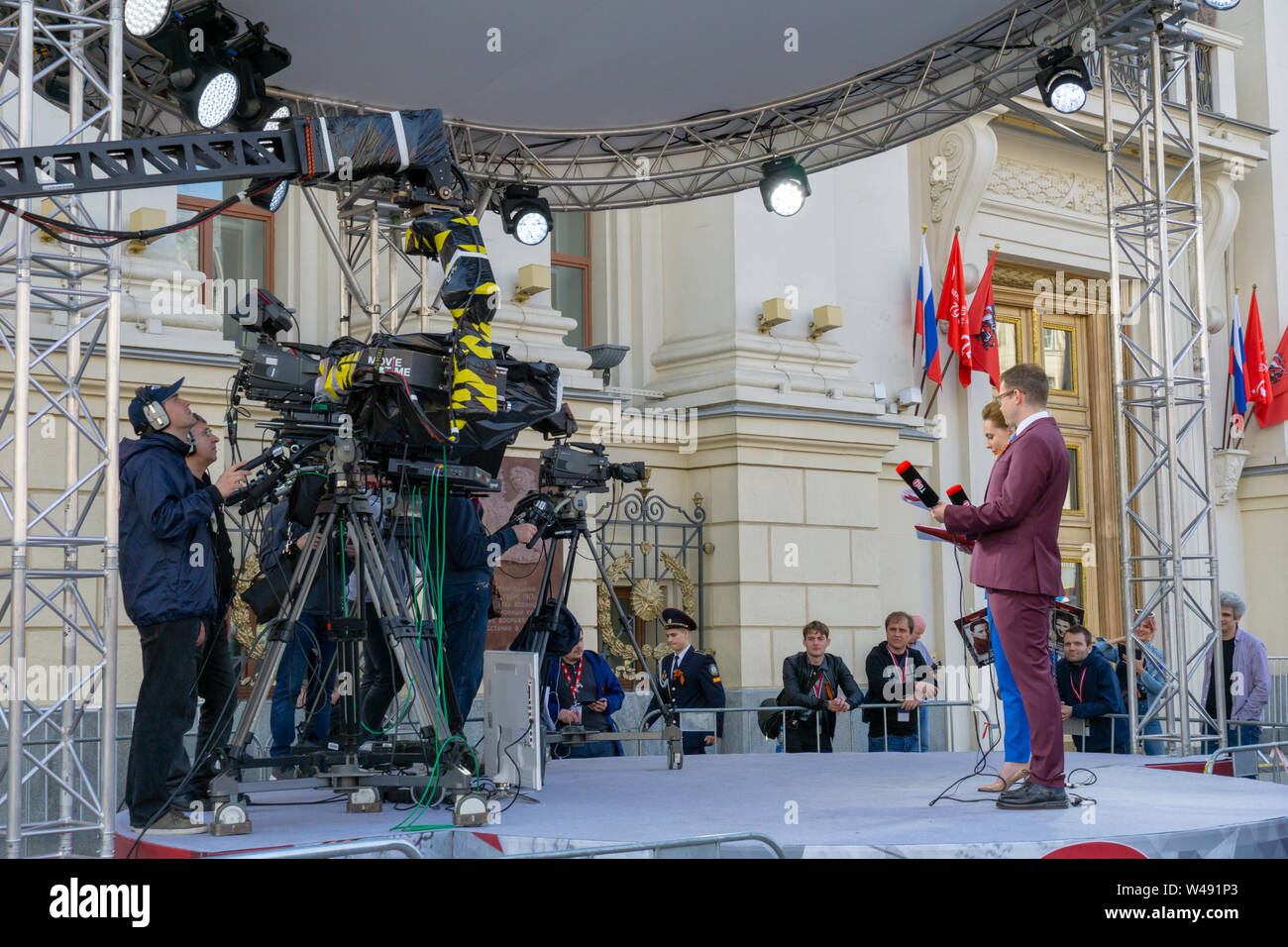 MOSCOW, RUSSIA - MAY 9, 2019: Recording TV program during the Victory Day Parade. TVC channel journalists are interviewing parade participants. Stock Photo