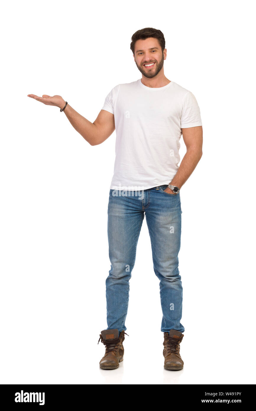 Young man in jeans and white t-shirt is 