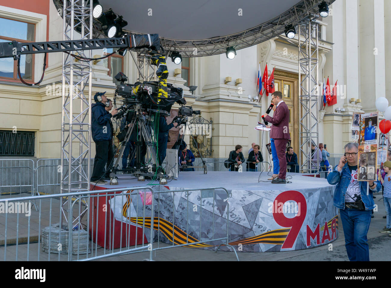 MOSCOW, RUSSIA - MAY 9, 2019: Recording TV program during the Victory Day Parade. TVC channel journalists are interviewing parade participants. Stock Photo