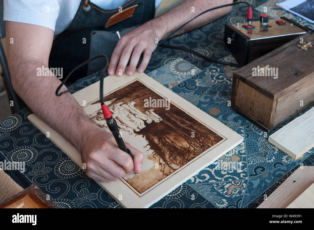 The Pyrography is an engraving technique by means of a heat source, on wood, leather, cork and other materials. Stock Photo