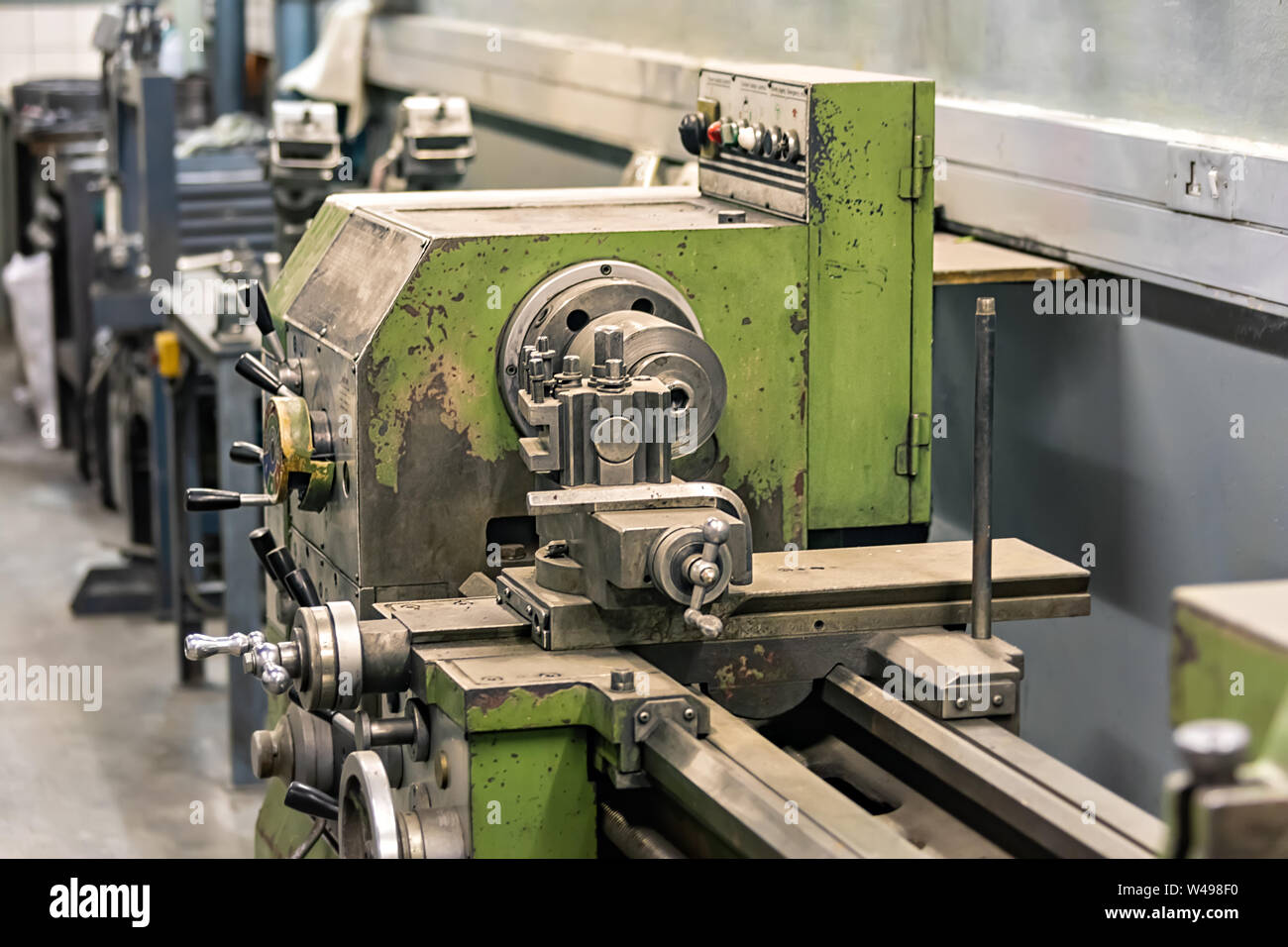 A lathe machine in a well-organized industrial workshop Stock Photo - Alamy