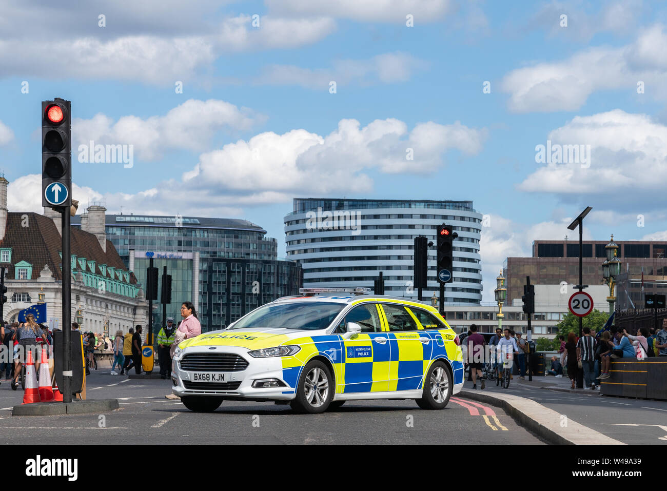 20th July 2019 - London, UK. Brand new Police Ford Mondeo vehicle blocking traffic on Westminster Bridge due to Anti Brexit protest. Stock Photo