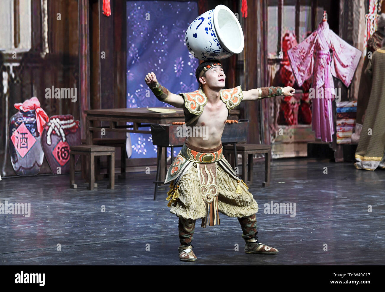 Zhangye, China's Gansu Province. 21st July, 2019. A performer acts out a scene during the debut of a new stage drama which depicts the history of Zhangye as a key Silk Road trade and cultural exchange hub at the Danxiakou tourism area in Linze County of Zhangye, northwest China's Gansu Province, July 21, 2019. Credit: Fan Peishen/Xinhua/Alamy Live News Stock Photo