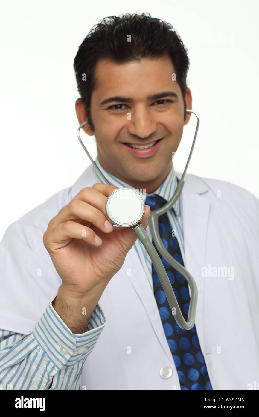 Portrait of a male doctor holding stethoscope Stock Photo - Alamy