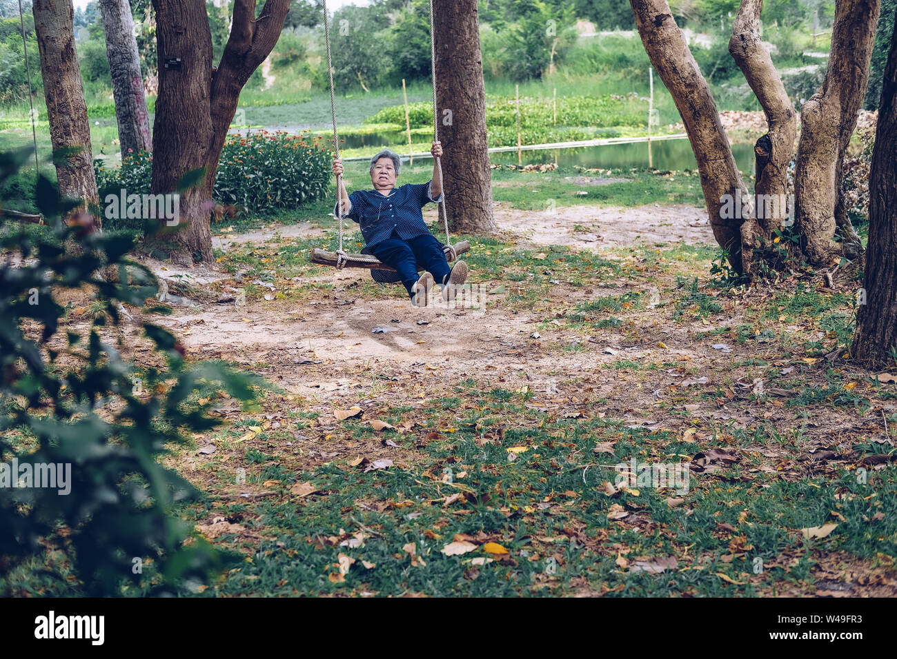 Mature woman summer swing hi-res stock photography and images - Alamy