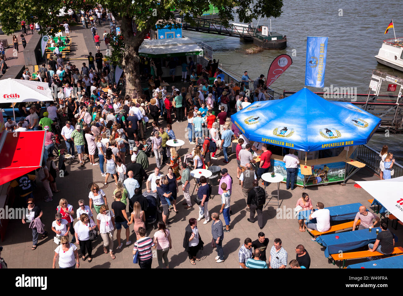 people at the beer festival on the banks of the Rhine, beer stands, Cologne, Germany.  Menschen auf dem Bierfest am Rheinufer, Bierstaende, Koeln, Deu Stock Photo