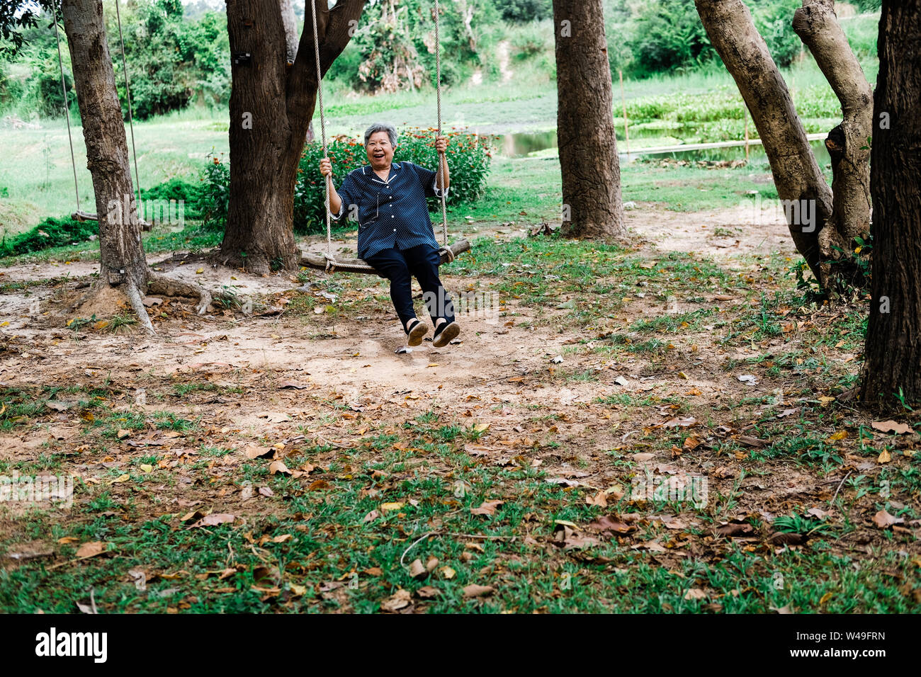 Elderly Swinging On Playground Adult Stock Photos Elderly
