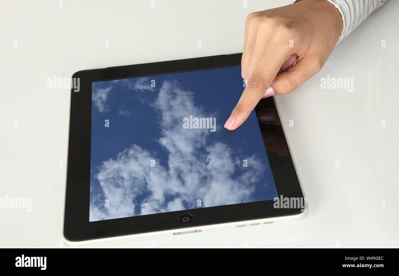 Close up of a person hand using a digital tablet Stock Photo