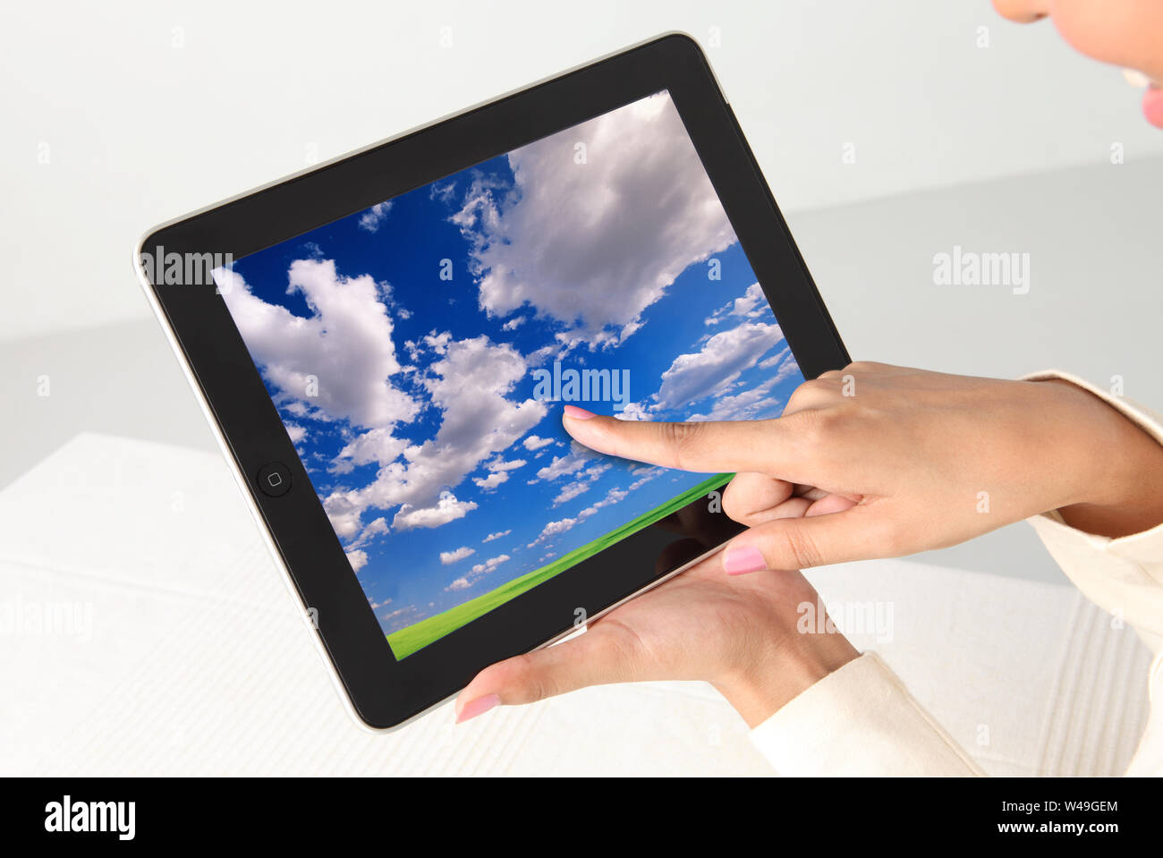 Woman hand using a digital tablet Stock Photo