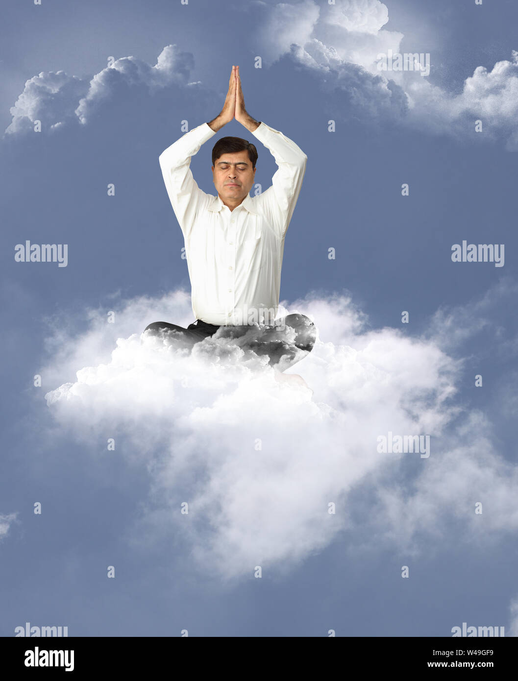 Businessman meditating Stock Photo
