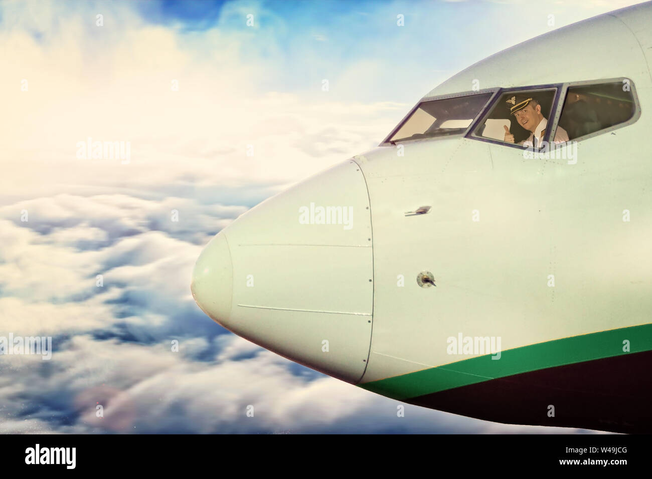 smiling pilot in the cockpit of the plane at height Stock Photo - Alamy