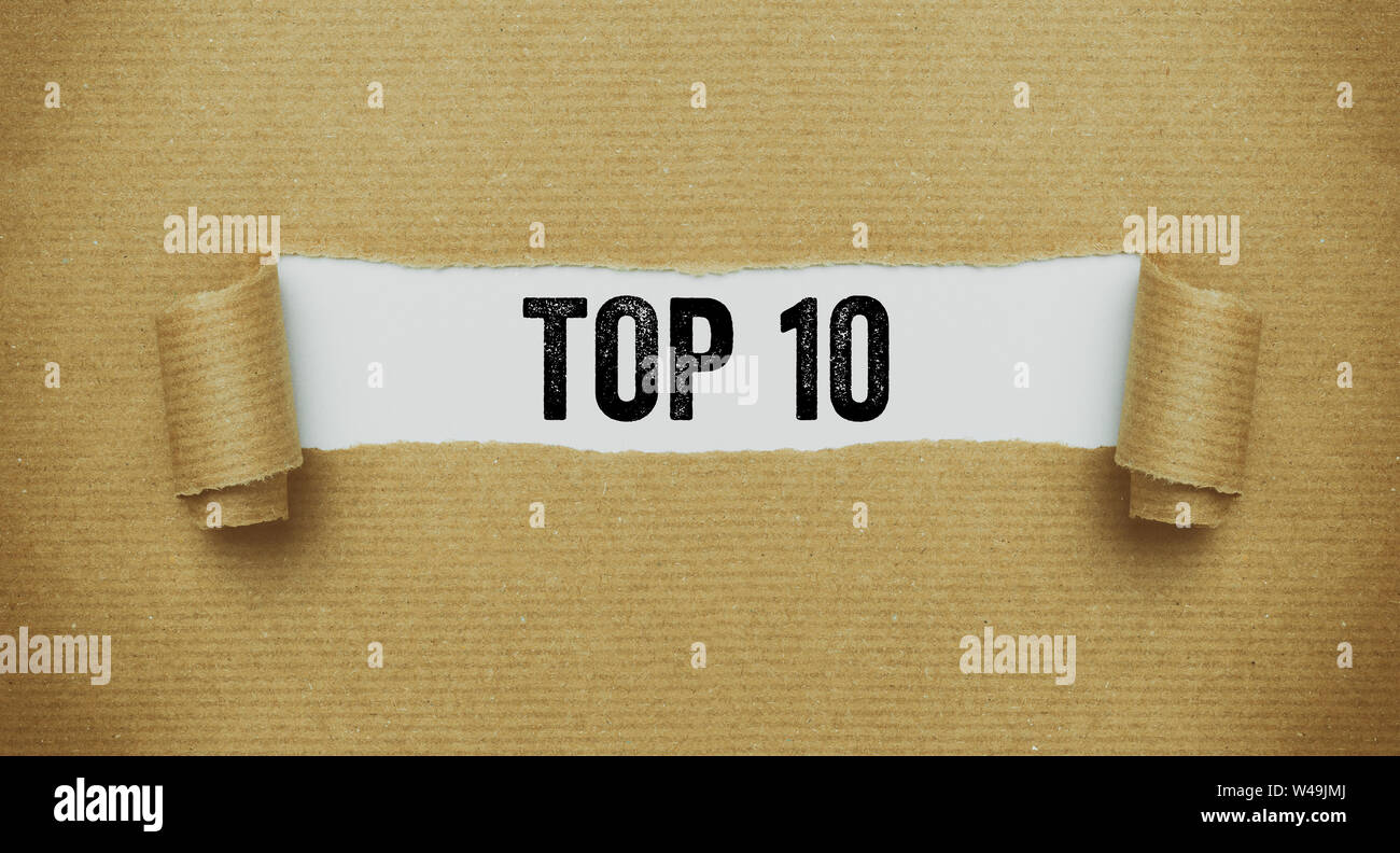Torn brown paper revealing the words Top 10 Stock Photo