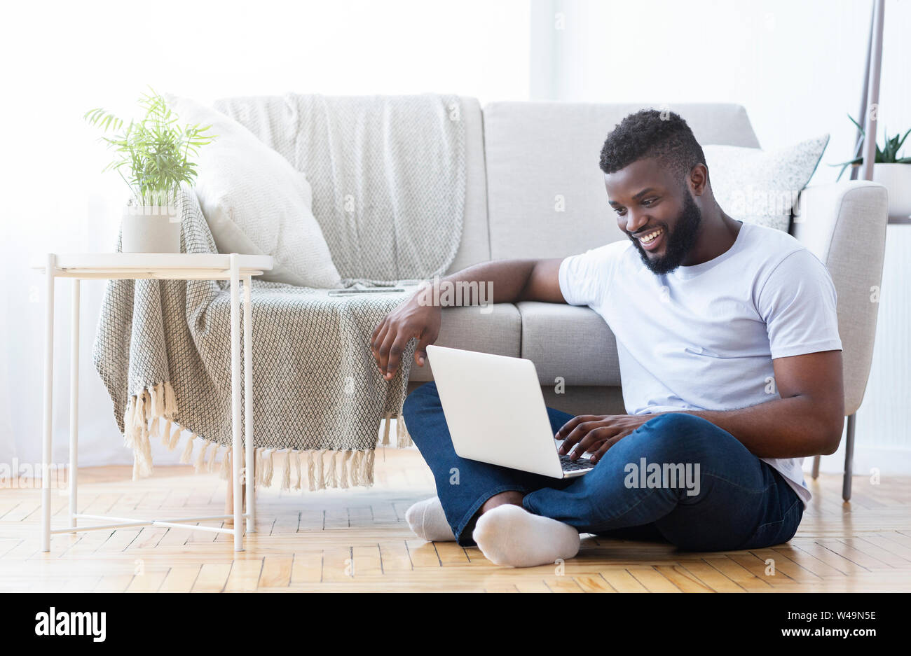African american guy playing video game on laptop Stock Photo Alamy