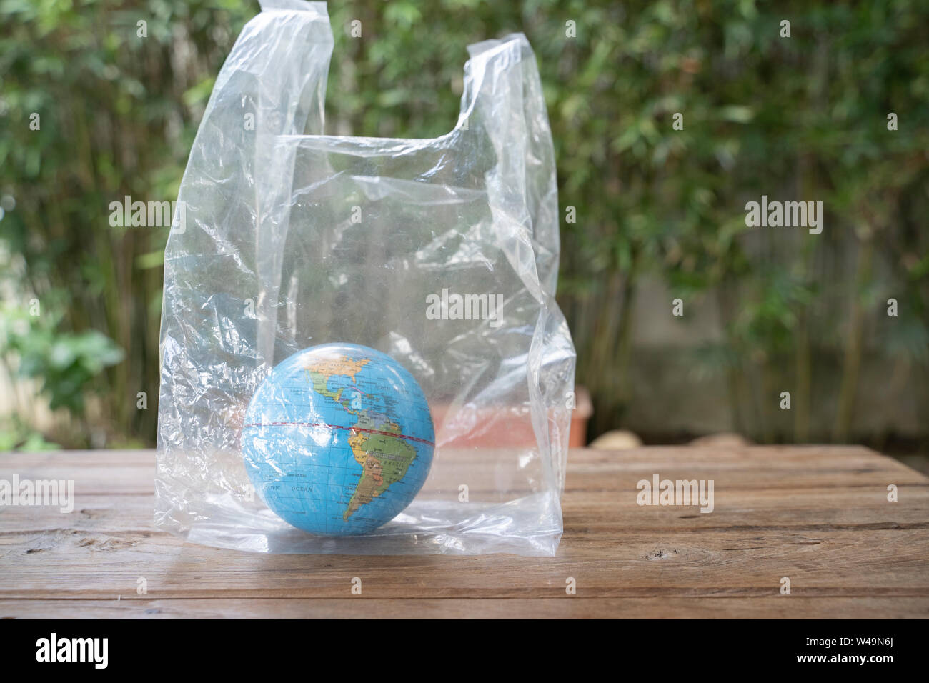Globe in polyethylene plastic disposable bag. Stock Photo