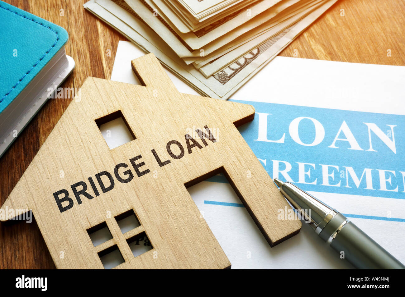 Bridge loan and mortgage agreement with pen Stock Photo Alamy
