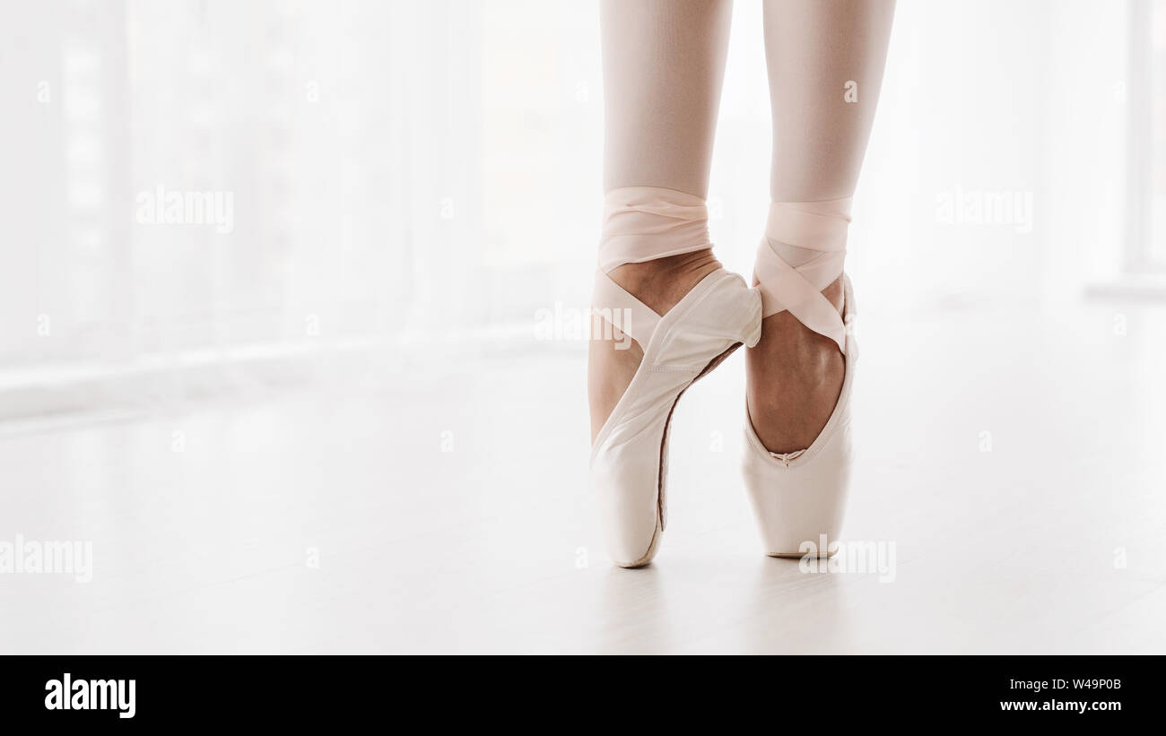 Ballerina Legs On Pointe Closeup. Classic And Modern Ballet Conc Stock Photo