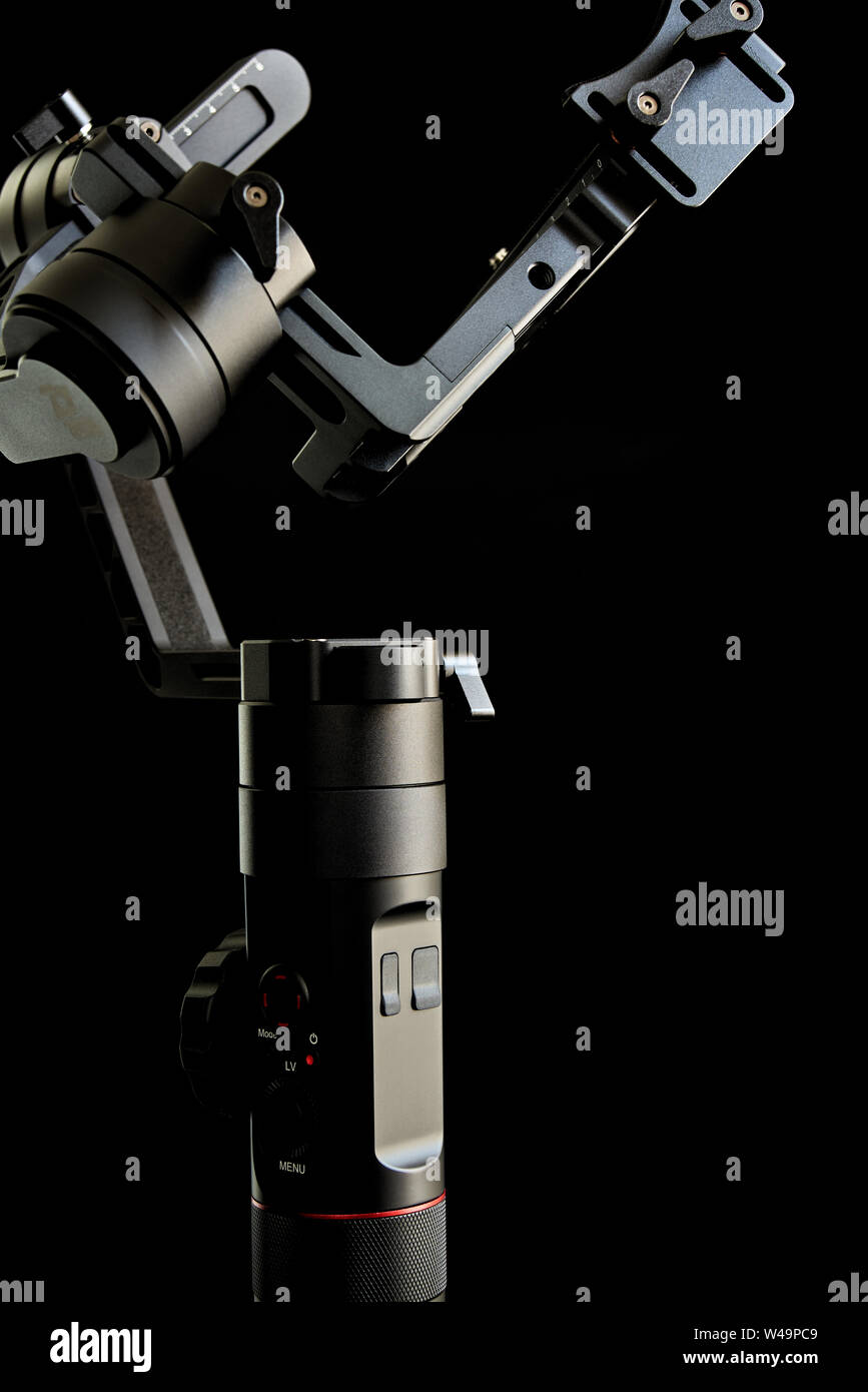 Close-up of gimbal stabilizer, with low-key lighting and a black background Stock Photo