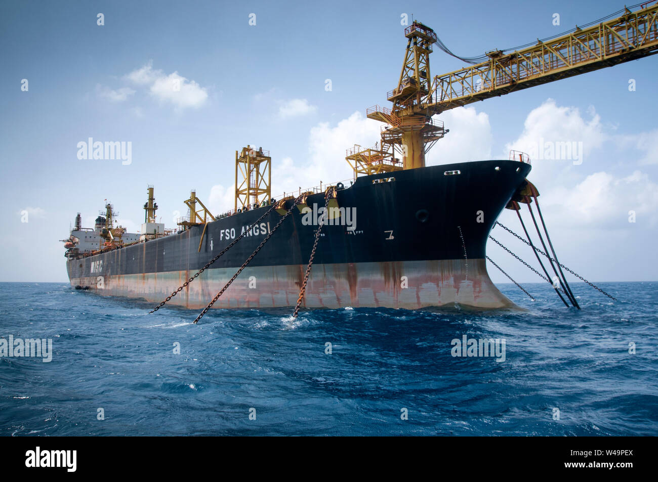 FPSO (floating production storage and offloading) or also known as floating storage tanker connect to oil platform at sea Stock Photo