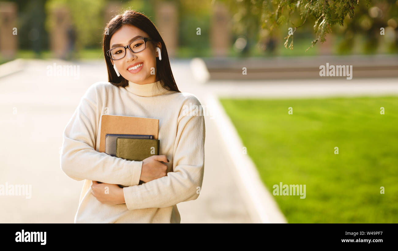 Learning concept. Student girl with books smiling to camera Stock Photo ...