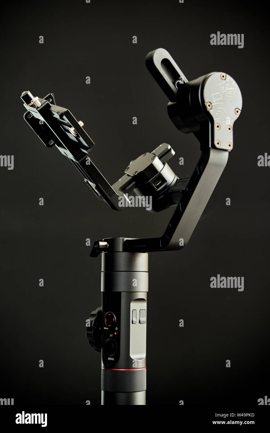 Grenoble, France - May 23, 2019: Close-up of Zhiyun Crane-2 stabilizer, with low-key lighting and a black background Stock Photo