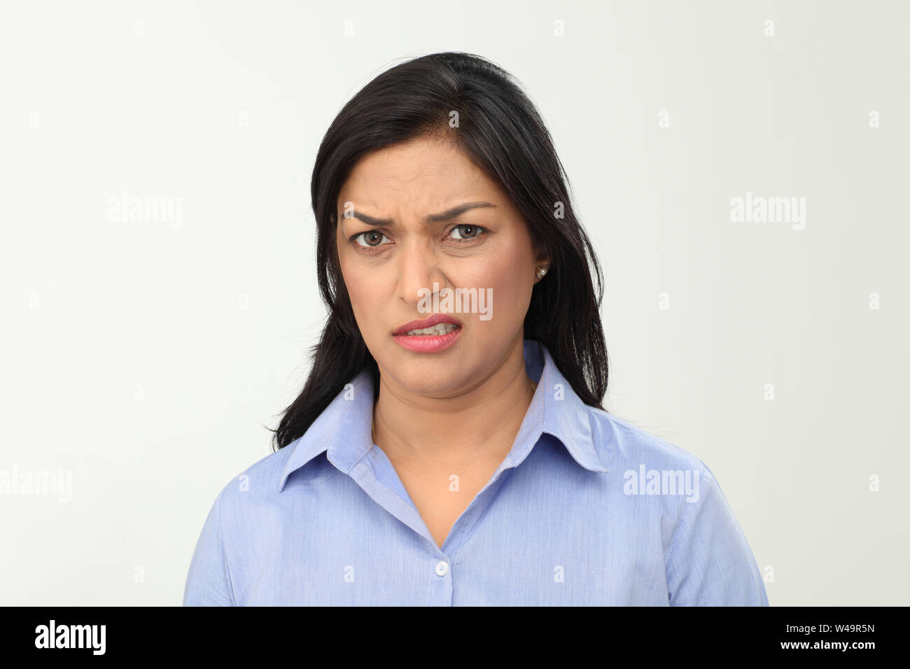 Portrait of an Indian woman grimacing Stock Photo - Alamy
