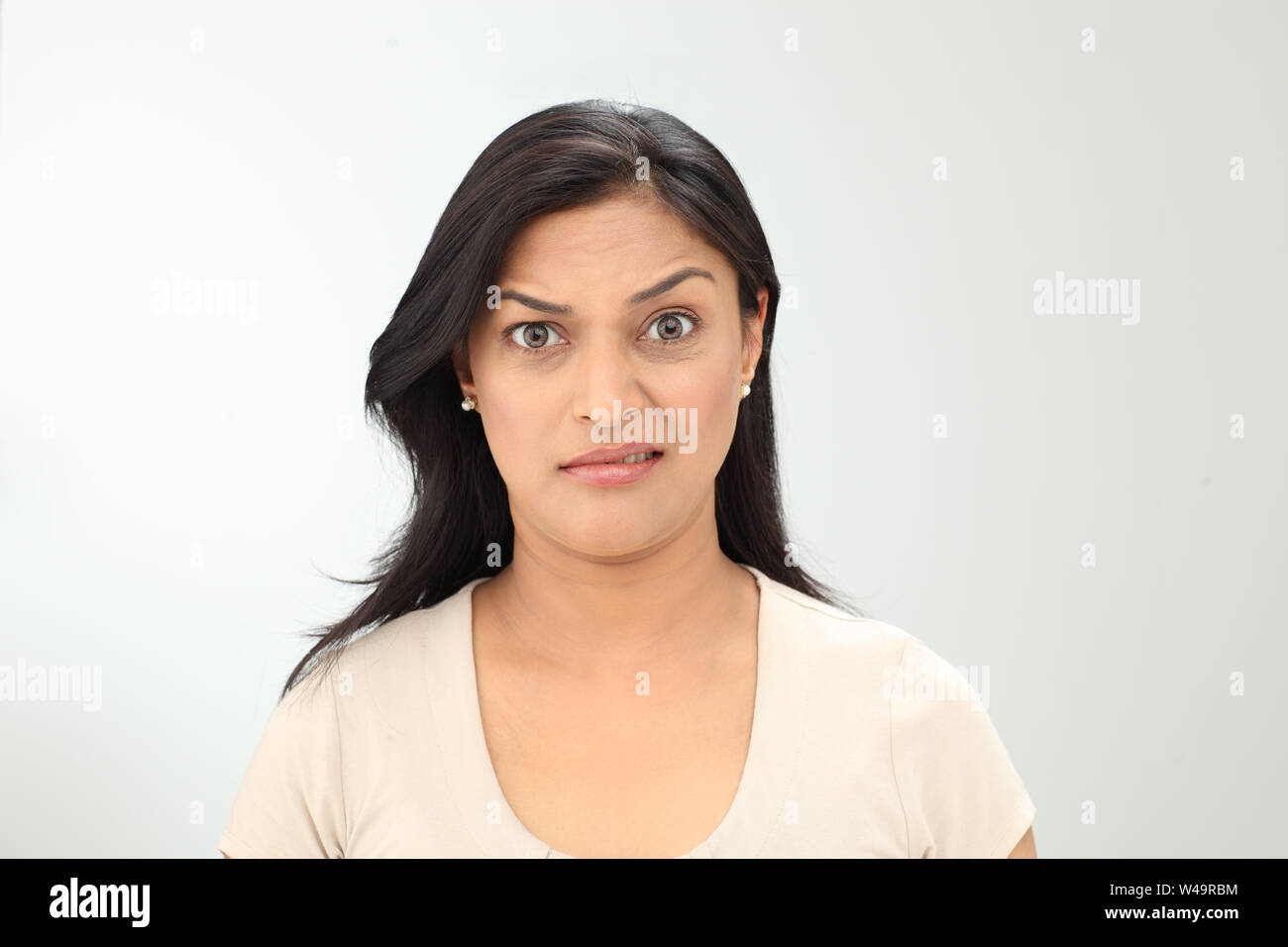 Portrait of an Indian woman grimacing Stock Photo - Alamy