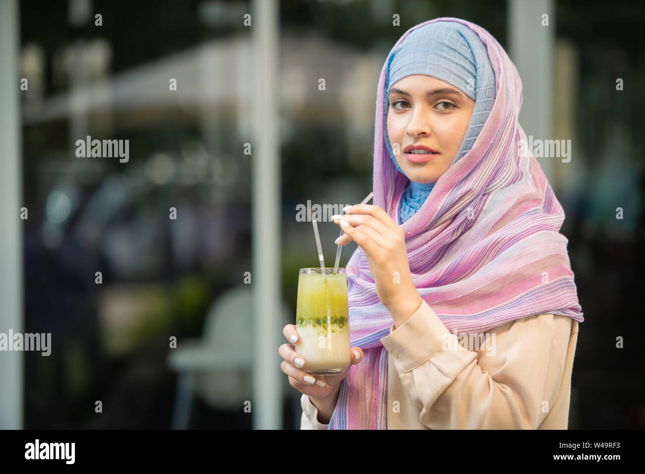 Hijab drinking hi-res stock photography and images - Alamy