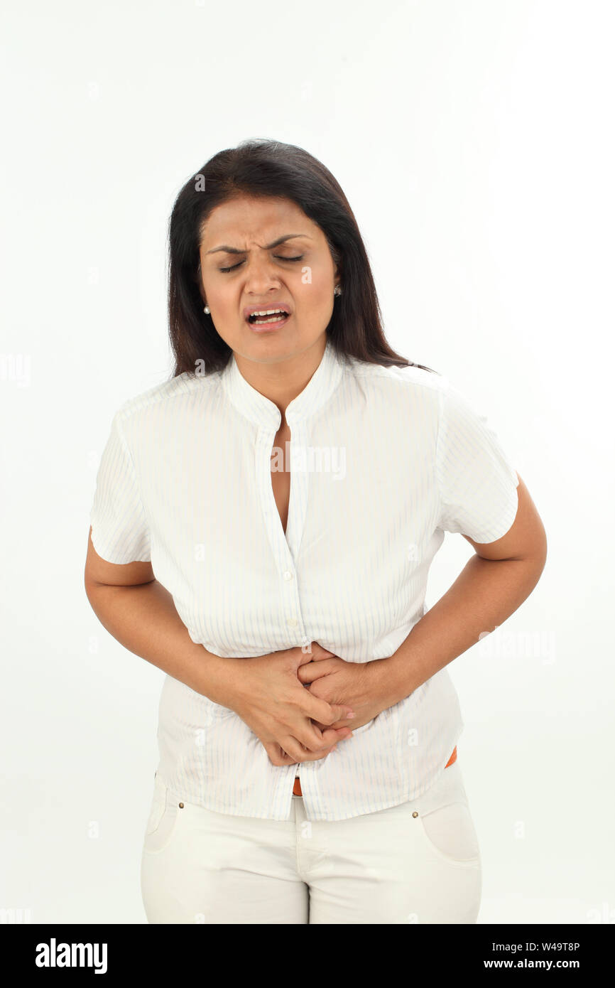 Indian woman suffering from abdominal pain Stock Photo Alamy