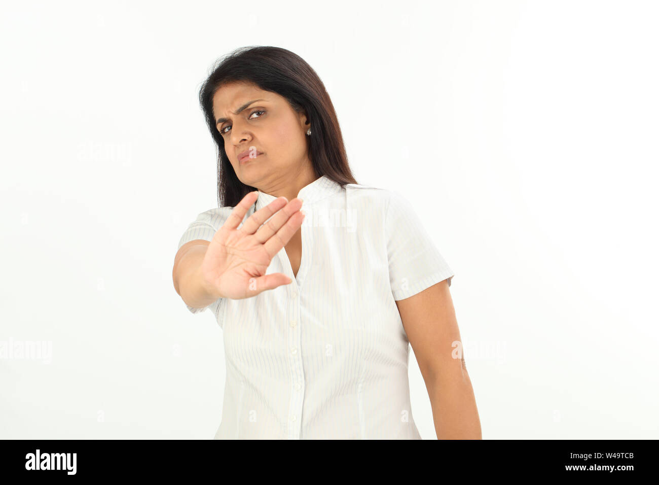 Mature woman gesturing stop palm hi-res stock photography and images ...