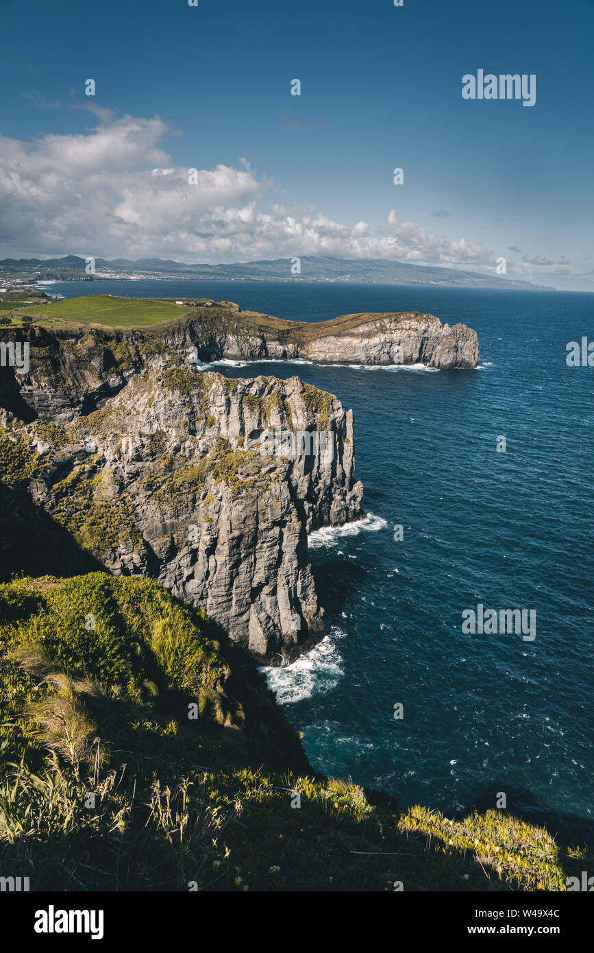 Lookout from Ponta do Cintrao at cliffs and coastline in sunny weather