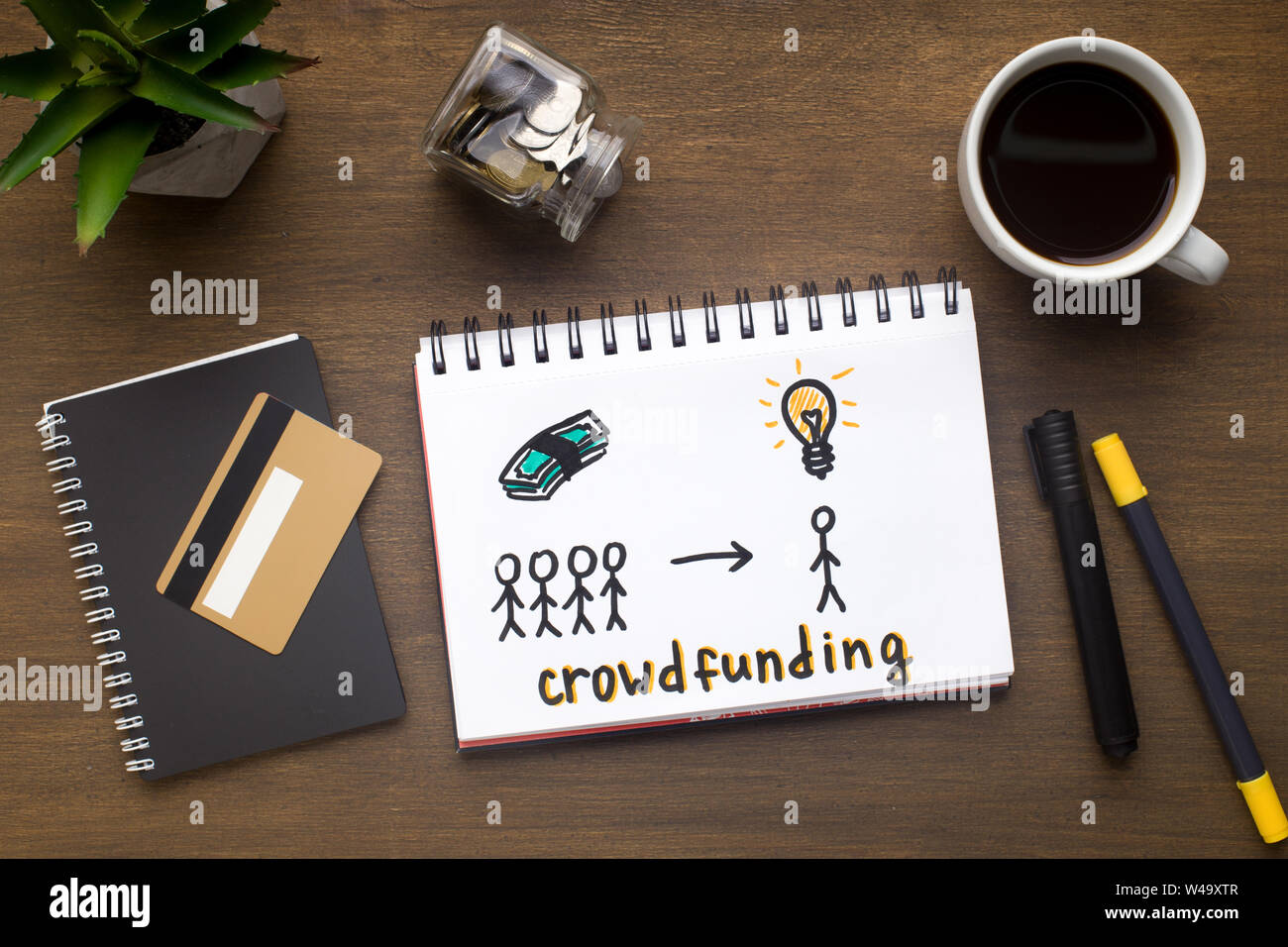 Drawing with crowdfunding concept in the notepad Stock Photo