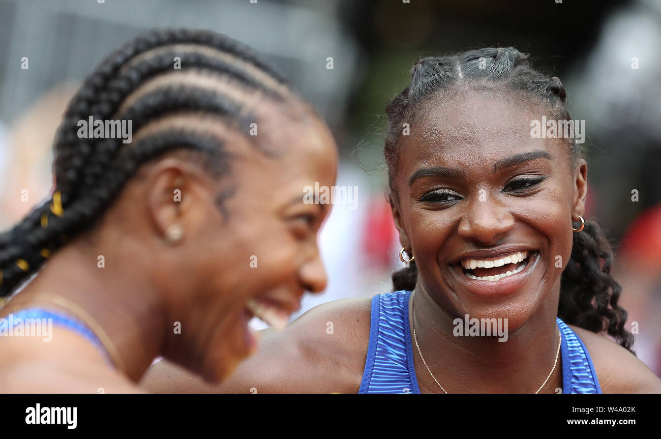 Jamaica's Shelly-Ann Fraser-Pryce and Great Britain's Dina Asher-Smith react after taking gold and silver in the Women's 100m final during day two of the IAAF London Diamond League meet at the London Stadium. Stock Photo