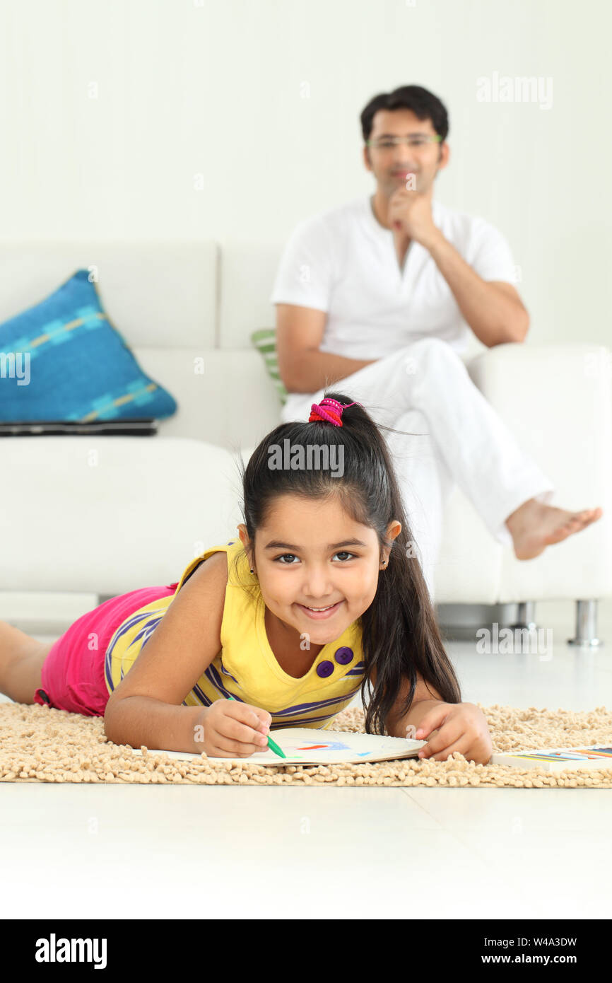 Girl lying on floor drawing hi-res stock photography and images - Alamy