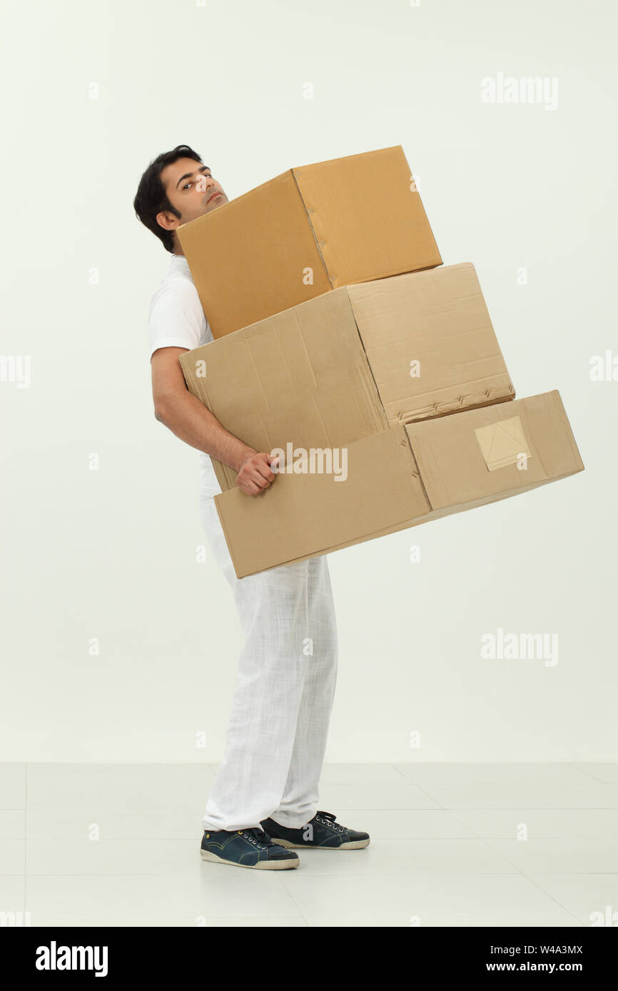 Man carrying boxes Stock Photo - Alamy