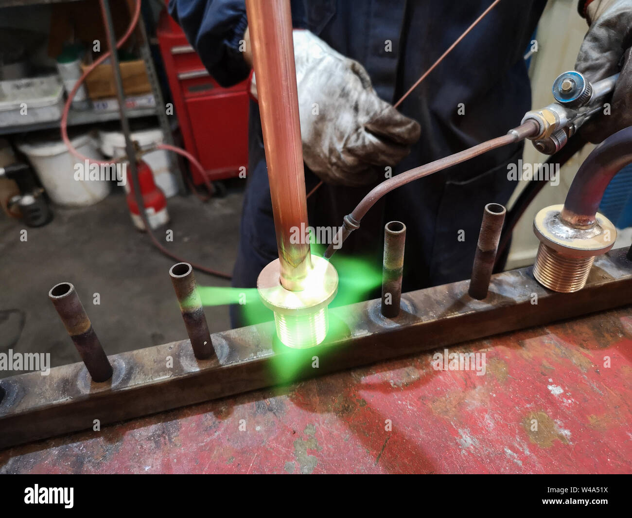 Detail of soldering of brass fittings on copper pipe Stock Photo Alamy