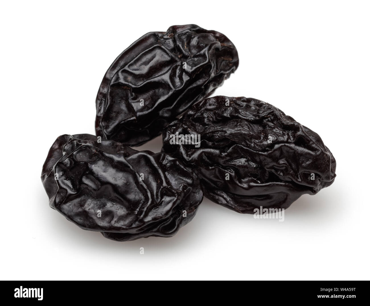 Dried black plums isolated on white background Stock Photo